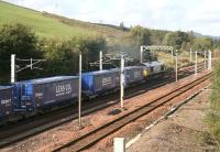 DRS 66406 brings the Tesco containers out of the down loop onto the main line at Beattock and starts the ascent on 12 October 2006.<br><br>[John Furnevel 12/10/2006]