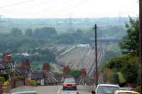 View looking west from above. The line to Ebbw Vale bears off to the right into the undergrowth.<br><br>[Ewan Crawford 26/06/2003]