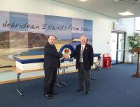 Ian Fox, of CalMac, receiving the Callander & Oban Railway wooden crest from Lord Faulkner of Worcester, chairman of the Railway Heritage Committee.<br><br>[Bob Gardiner (Network Rail) 11/11/2007]