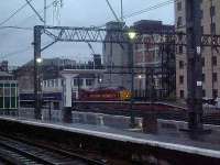 37417 Richard Trevithick departing on a typically wet Glasgow morning with the empty Caledonian Sleeper<br><br>[Graham Morgan 26/10/2006]