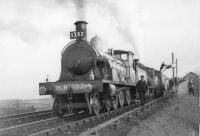 GNSR No 49 takes water at Barrhill with Scottish Rambler while HR 103 is oiled.<br><br>[John Robin 15/04/1963]