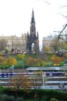Waverley, the Scott Monument and a view over the Forth to Fife. Train in two liveries wait at the west end of the station.<br><br>[Ewan Crawford 11/11/2006]