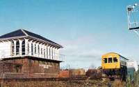 View of box, as a Cumbernauld to Springburn 101 passes the dividing home signal.<br><br>[Brian Forbes //1983]