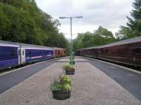 Rush hour at Arrochar & Tarbet- sleeper waits for southbound Royal Scotsman to clear the loop before proceeding<br><br>[Paul D Kerr 04/09/2006]