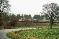 A pair of class 47s heads a Victa Railfreight service south near Lamington in November 2006. The stock consists of ex-Motorail vans used for the transport of cars.  <br><br>[John Furnevel 03/11/2006]
