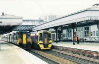 150261 calls at platform 3 with an Edinburgh local service. 158704 is an express for Aberdeen.<br><br>[Brian Forbes //1993]