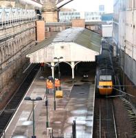 <I>'Now then, about this canopy...'</I> Progress meeting on platforms 20 & 21 at Waverley on 25 November 2007 (a 'sub' committee?) with the 0950 Aberdeen - Kings Cross about to restart from the latter. Note the new brickwork on the modified walkway in connection with construction of new lifts and stairways, including access to the new Klondyke through platform on the other side of the south wall.<br><br>[John Furnevel 25/11/2007]