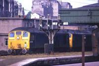 A pair of class 24s with 24125 leading and 24108 trailing pass northbound through Aberdeen platform 8 in July 1974. <br><br>[John McIntyre /07/1974]