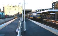 Looking east along platforms 0 and 1 towards the main Haymarket station on 6 December 2006. Trains to and from Waverley stand at platforms 1 and 2, while a contractors vehicle is in the new bay platform 0.<br><br>[John Furnevel 06/12/2006]