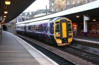 A First ScotRail 158 service to Dunblane. All part of the seemingly non-stop cavalcade through Haymarket platform 4, December 2006.<br><br>[John Furnevel /12/2006]