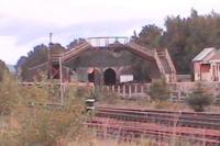 Portals of Aviemore shed 60B are framed under old footbridge at the Speyside station.<br><br>[Brian Forbes /09/2006]