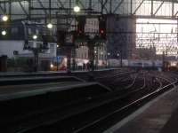 A Class 390 and a Class 156 arrive at Glasgow Central.<br><br>[Graham Morgan 05/12/2006]
