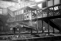 <I>Heave...!!!</I> Demolition of stairs on the northside walkway at Aberdeen in March 1973. The walkway leads to the former GNSR suburban booking office.<br><br>[John McIntyre /03/1973]