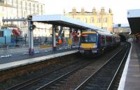 Work on the erection of the canopy over the new platform 0 at Haymarket underway on 11 December 2006, as a returning Fife Circle DMU leaves platform 1 for Waverley.<br><br>[John Furnevel 11/12/2006]