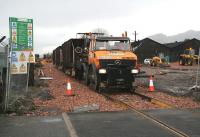 Ballast <I>train</I> at Cambus level crossing on 15 December looking west.<br><br>[John Furnevel 15/12/2006]