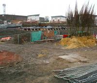 View north over Alloa station site on 22 December 2006. No work taking place. Plastic sheeting covers the base of the station building and a selection of young trees has appeared ready for planting.  <br><br>[John Furnevel /12/2006]