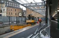 Looking towards the buffer stops along Haymarket's new platform 0 on 20 December 2006 with work on the canopy now underway. Haymarket tunnel can be seen at the end of platform 1 on the right and the doomed Caledonian Alehouse stands on the left. [See image 23206]   <br><br>[John Furnevel 20/12/2006]