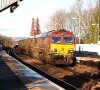 Coal empties from Longannet rumble off the Forth Bridge and into Dalmeny station on 10 January in bright Winter sunshine.<br><br>[John Furnevel 10/01/2007]
