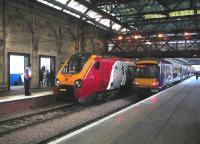 Platforms 10 and 11 on 7 January 2007 occupied by a Virgin CrossCountry train for Bournemouth and a ScotRail shuttle for Glasgow Queen Street.<br><br>[John Furnevel 07/01/2007]
