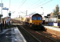 Fu-fur-fu-fur-fu-freezing cold morning at Kingsknowe on 25 January with the predominant sound being the crunch of shoes (mine) on rocksalt. Thoughts start to stray towards warmer hobbies...when an eastbound coal train clatters over the crossing...<br><br>[John Furnevel 25/01/2007]