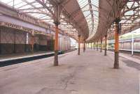 A view of the Wemyss Bay platforms in 1985. The boarded up entrance on the far platform led to a small rest room and store once used by tradesmen.<br><br>[John Gray /07/1985]