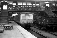An Inverness service departs from platform 6 at Aberdeen in March 1973 with demolition work underway on the north end walkway.<br><br>[John McIntyre /03/1973]