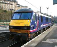 EWS 90019 stabled at Waverley on 4 February 2007. The locomotive is one of a dedicated pool of 5 EWS locomotives in First ScotRail livery for use on the Caledonian Sleeper services between Edinburgh/Glasgow and London.<br><br>[John Furnevel 04/02/2007]