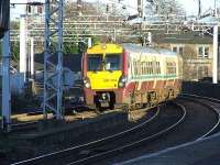 334009 crossing Wallneuk Junction as it enters Paisley Gilmour Street with a Gourock service.<br><br>[Graham Morgan 10/01/2007]