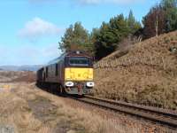 67005 <I>Queens Messenger</I>, in Royal Train livery, is pictured going south with a ten van train between Newtonmore and Dalwhinnie. <br><br>[John Gray 14/02/2007]