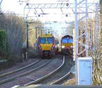 66403 on the daily <i>W. H. Malcolm</i> Elderslie to Grangemouth service passes 334011 outside Paisley Gilmour Street.<br><br>[Graham Morgan 10/01/2007]