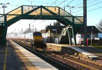 A low winter sun casts long shadows at Prestonpans in February 2007 as a GNER service speeds through on its way to Kings Cross.<br><br>[John Furnevel 21/02/2007]