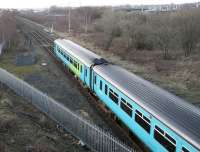 A service from Leeds approaches Carlisle in February 2007 on the S&C route, with Petteril Bridge Junction in the distance. The derelict area to the left of the running lines was once the home of Durranhill shed. [See image 27181]<br><br>[John Furnevel 26/02/2007]