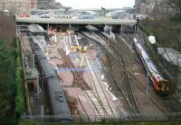 General view of Waverley west end progress on 28 February 2007. An Aberdeen bound HST is leaving platform 19 passing a 158 in South West Trains livery. <br><br>[John Furnevel 28/02/2007]