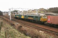 Southbound containers through Carstairs in March 2007 behind a pair of Class 86 locomotives.<br><br>[John Furnevel /03/2007]