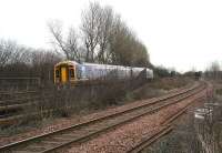 An eastbound service passing the remains of the 1903 NB Camelon station in January 2007. As can be seen, the station  stairway up to the island platform is still in place, although now partially bricked up at street level. [See image 13253]<br><br>[John Furnevel 23/01/2007]