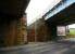 The bricked-up entrance to the abandoned NB Camelon station, seen from the west side of the A9 road in January 2007. Behind the brick wall is the stone stairway that led up to the island platform. [See image 6131]<br><br>[John Furnevel 23/01/2007]