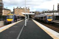 Dundee train leaving platform 2 on 3 March passes a Cowdenbeath service waiting in platform 0.<br><br>[John Furnevel /03/2007]