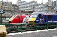 Waverley east end on 17 March with a Voyager standing alongside First ScotRail liveried locomotive 90024 stabled in the bay between Sleeper duties.<br><br>[John Furnevel 17/03/2007]