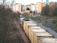 An EWS class 66 with empty <i>Binliner</i> containers returning from Oxwellmains, having just passed through Meadowbank, approaches the former Lochend South Junction on 19 March 2007 on the way back to Powderhall depot. <br><br>[John Furnevel 19/03/2007]