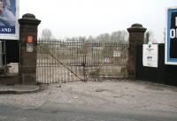 By 1930, thanks to an abundance of good quality local spring water and the railway, Duddingston played host to the seven breweries of Messrs Deuchar, Drybrough, Maclachlan, Raeburn, Steel Coulson, T.Y.Paterson and North British - all rail served. The yard entrance gates to the demolished T.Y.Paterson brewery stand alongside the site of the level crossing on Duddingston Road in 2007 - though probably not for much longer, given the surrounding area has been cleared ready for new commercial developments. [See image 60481]    <br><br>[John Furnevel 28/03/2007]