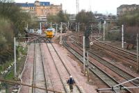 Sunday engineering works at Larkfield Junction on 1 April 2007. The quadruple lines to the right are for Glasgow Central, the track machine is on the route through to Shields Junction, while branching off to the left are the lines to Muirhouse South Junction.<br><br>[John Furnevel 01/04/2007]