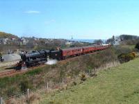 A member of the support crew checks the water level. Helmsdale and the North Sea in the background. On the right a sprinter sneaks by on a regular working to Wick/Thurso.<br><br>[John Gray 12/04/2007]