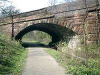 Caledonian Railway Lanarkshire and Dumbartonshire line, bridge carrying Glasgow/Dumbarton Road. The stonework has been patched with brick over the years where vehicles have crashed through.<br><br>[Alistair MacKenzie 13/04/2007]