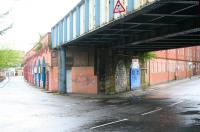 View south along Molendinar Street towards Gallowgate on a wet 6 May 2007, with Bell Street running off to the right. Below the bridge is the infilled arch that once formed the entrance to Gallowgate station (closed 1902). The bridge still carries the CGU line north towards High Street East Junction. <br><br>[John Furnevel 06/05/2007]
