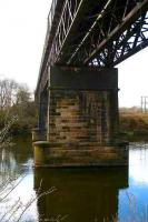 The sandstone piers and lattice deck girders of Westburn Viaduct, Carmyle, photographed in April 2007 looking south across the Clyde. The line closed in 1983.<br><br>[John Furnevel 08/04/2007]