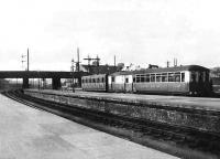 LNER Sentinal steam railcar 310 <I>Prince Regent</I> coupled to an ex-NB 6-wheel coach simmers at Stirling station in 1938.   <br><br>[Frank Inglis Collection //1938]