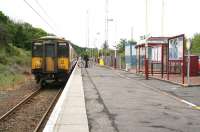 A Largs - Glasgow Central train picks up 2 passengers and a bike at Fairlie on 17 May 2007. [see image 31881]<br><br>[John Furnevel 17/05/2007]