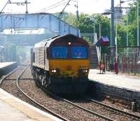 EWS 66083 brings a Hunterston - Longannet coal train through Kilwinning on 3 May 2007.<br><br>[John Furnevel 03/05/2007]