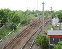 View west at Holm Junction, Ardrossan, in May 2007. From left to right are the lines to Ardrossan Harbour, the former line to the sidings and shed, the passenger line to Largs and the freight only line used mainly by the Hunterston coal trains.<br><br>[John Furnevel 17/05/2007]
