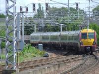 334011 crosses Wallneuk Junction at the rear of a two unit set as it heads for Glasgow Central<br><br>[Graham Morgan 22/05/2007]